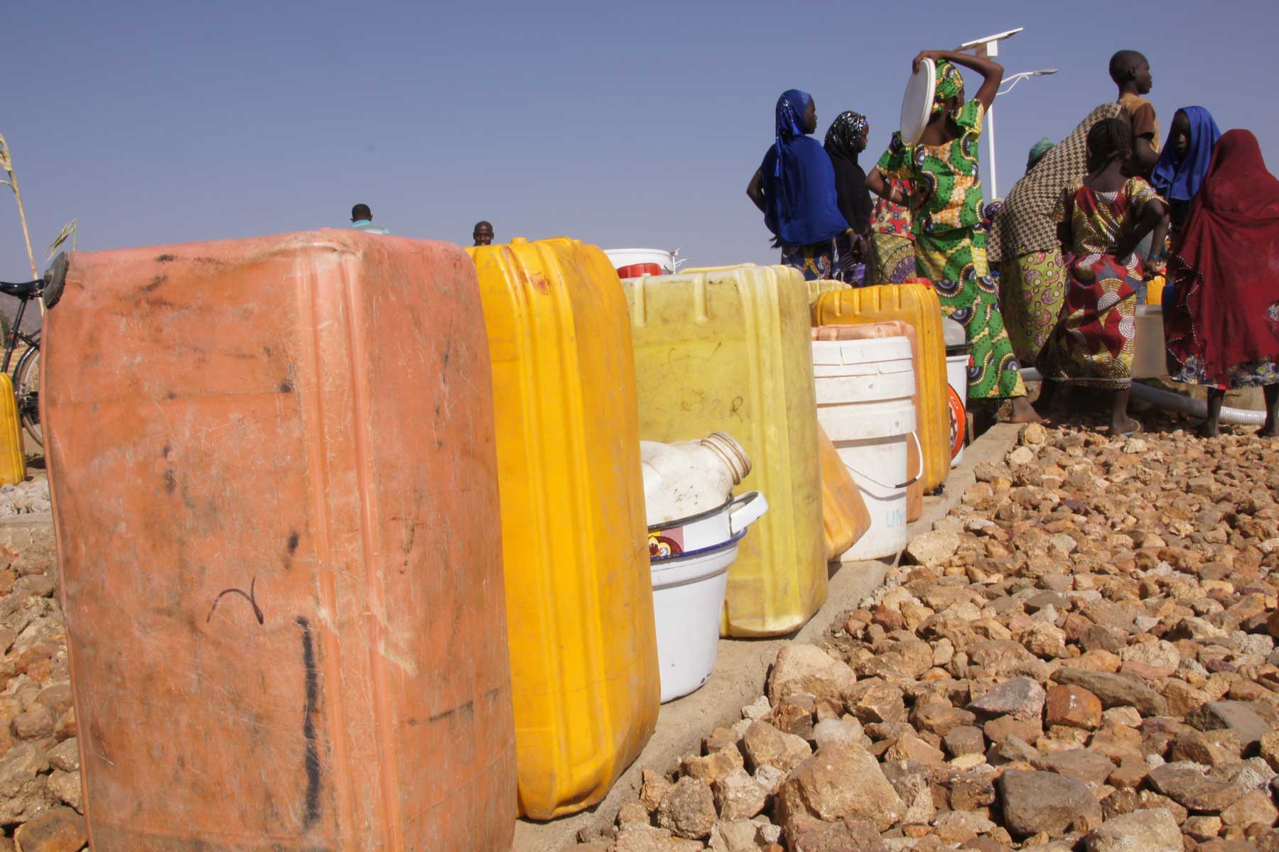 The two water bladders in his charge contain 10,000 liters each. Between four and ten bladders are needed on an average day. 