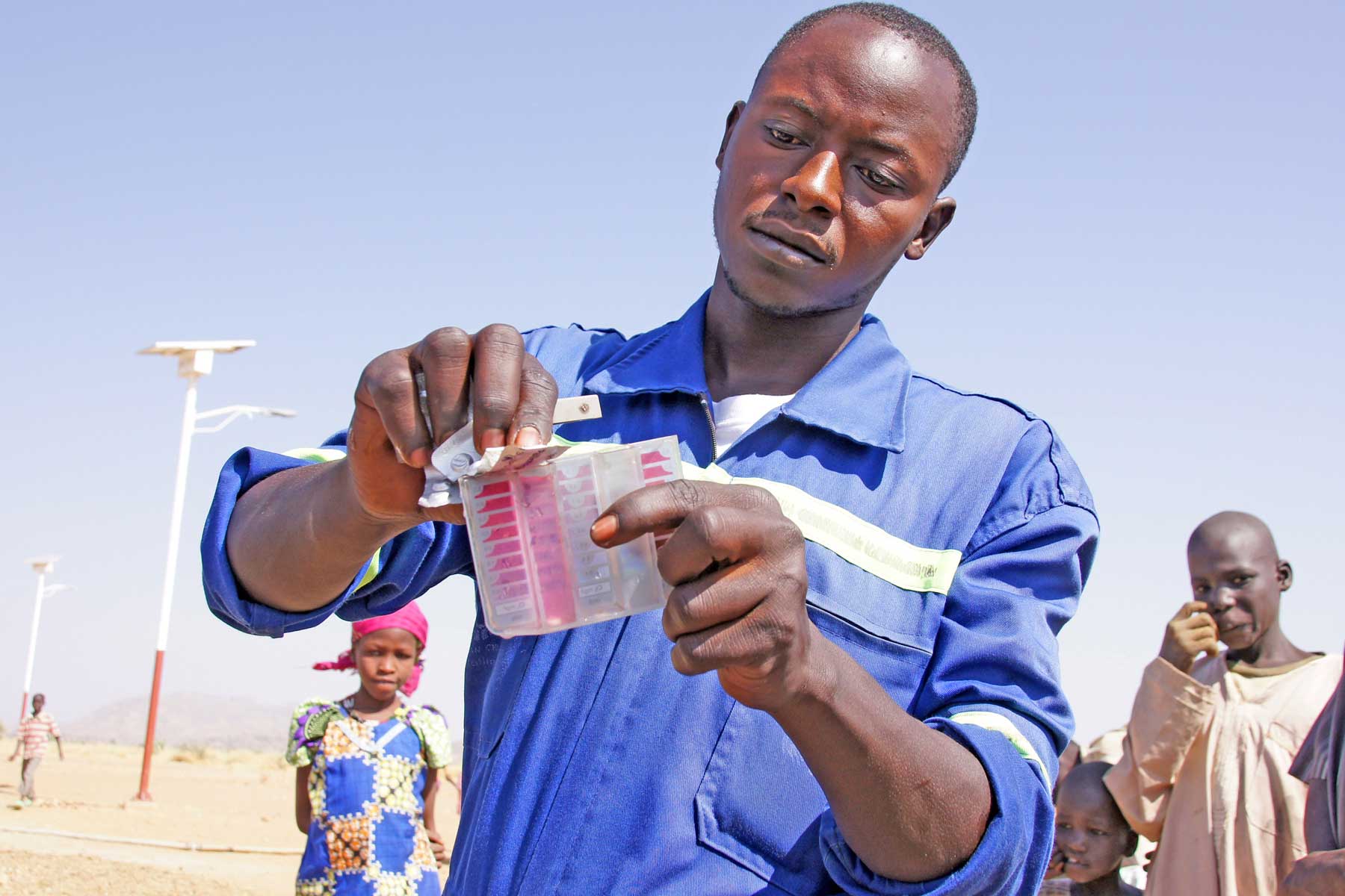 The final water check is performed by Ezra Naulaha, another engineer trained by LWF.