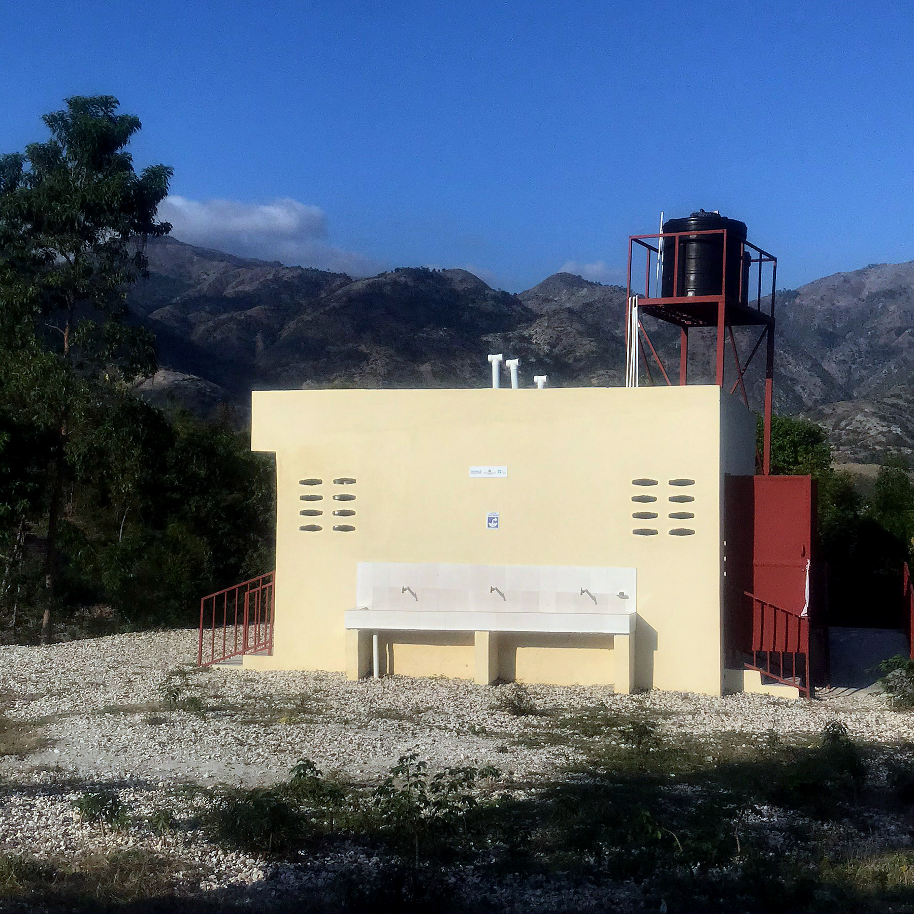 A new toilet block has been built for students at Vieux Caille school with a water tank on the roof to serve the handwashing stations