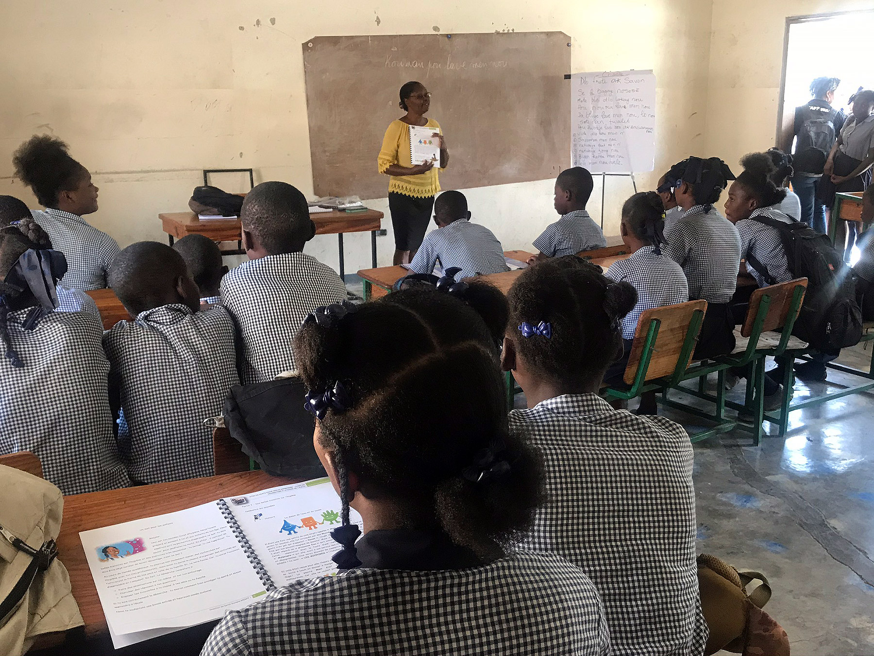 Students in a class at Gressier National School learn about how to prevent the spread of infection