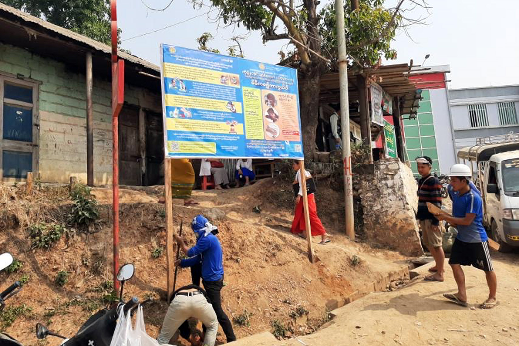 Billboards are erected with information in local languages about how to prevent the spread of COVID-19 infections