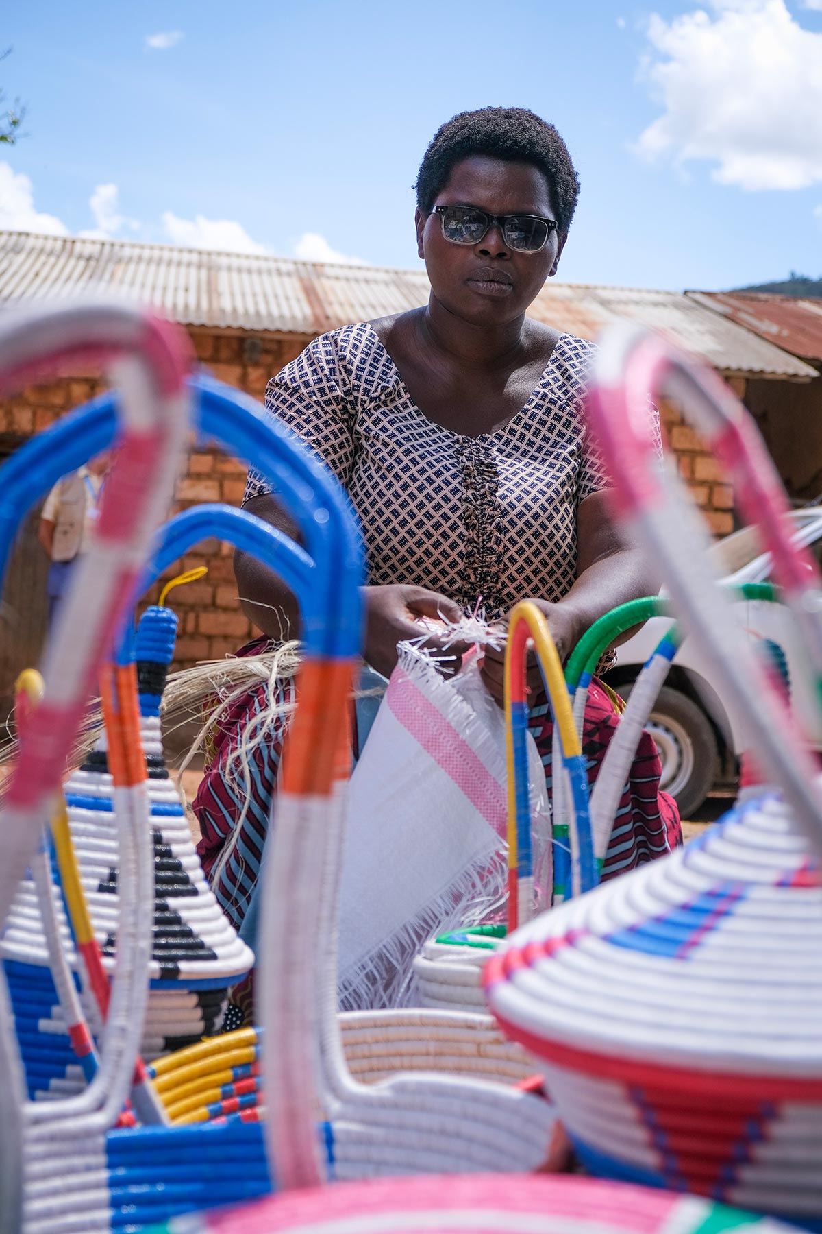 Members of Péline’s cooperative make woven baskets for additional income.