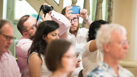  LWF head of communications Ãrni Svanur Danielsson (right) and Dr Jerzy Janusz Sojka from the Evangelical Church of the Augsburg Confession in Poland take photos during the LWF Council meeting 2018. Photo: LWF/ Albin Hillert