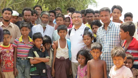 Bhoj with camp management committee members and children in an IDP camp in Sittwe. Photo: LWF Myanmar