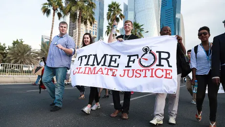 Lutheran youth and ecumenical partners joined hundreds of demonstrators on 1 December for a climate march in Qatar to demand action at the COP 18 summit. Â© LWF/Sidney Traynham