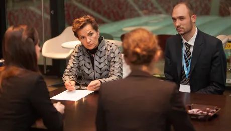 Cristiana Figueres speaking with the LWF COP19 delegation. Photo: LWF/Sean Hawkey