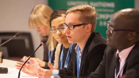 LWF delegate to UN Climate Conference (COP19) meeting in Warsaw, Poland, in 2013. Photo: LWF/Sean Hawkey