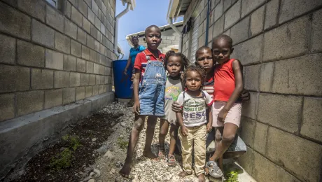 Tiny survivors of the 2010 Haitian earthquake gather outside the Model Resettlement Village in Gressier  