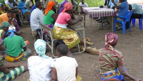 LWF staff collect information about human rights concerns at a village in Mozambique. Photo: S. Oftadeh