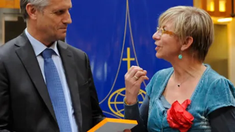 (right) equal-salary Executive Director VÃ©ronique Goy Veenhuys awards the equal wage certification label to LWF General Secretary Rev. Martin Junge. Â© LWF/H. Putsman Penet