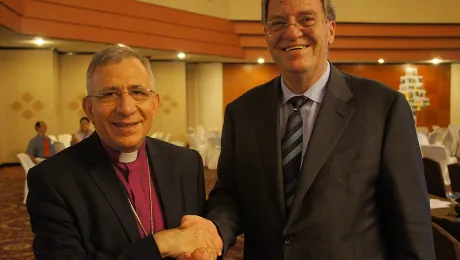 LWF President Bishop Dr. Mounib Younan thanks outgoing DWS Director Eberhard Hitzler for his dedicated service. Photo: LWF/S. Lawrence