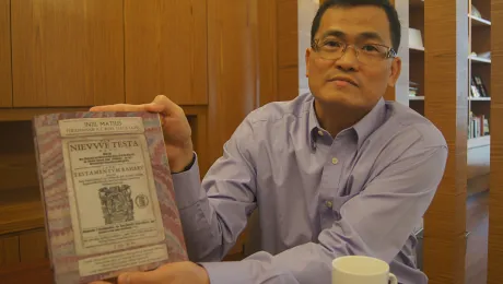 LCM Bishop Aaron Yap shows a 16th century Bible. Photo: LWF/C. KÃ¤stner