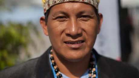 Activist displaying traditional headdress at COP20. Photo: LWF/Sean Hawkey