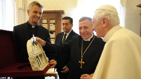 December 2010: LWF General Secretary Rev. Martin Junge (left) and LWF President Bishop Dr Munib A. Younan (middle) present Pope Benedict XVI with a gift from Bethlehem depicting the Last Supper. Â© Servizio Fotografico 