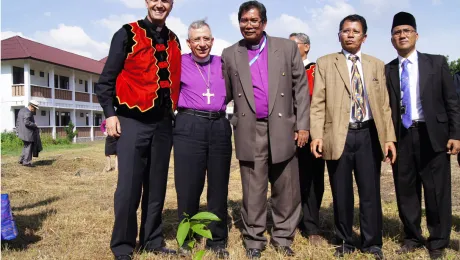 (From left) LWF General Secretary Martin Junge, LWF President Bishop Dr Munib Younan, LWF National Committee in Indonesia Chairperson Bishop Langsung Sitorus and other member church representatives with a Luther Garden partner tree planted at the Ecumenical Center of the Council of Protestant Indonesian Churches in North Sumatra on 15 June 2014. Photo: LWF/C. KÃ¤stner