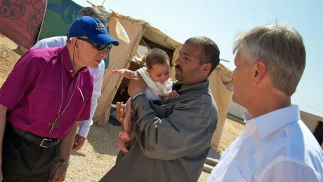 LWF President Bishop Dr Munib A. Younan (left) and LWF General Secretary Rev. Martin Junge (right) meet Nabeel, one of the children who make up 52 percent of Zaâatriâs population, during a visit to the camp in late September. Â© LWF/Thomas Ekelund