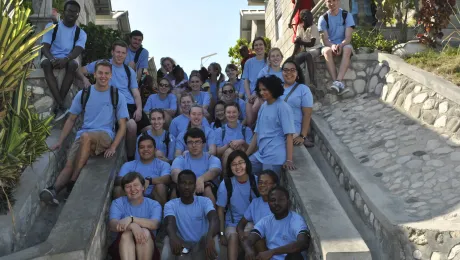 Students from Luther College in the United States take in sights and stories at LWF's model village in Gressier, Haiti.Photo: LWF/Helene Branco