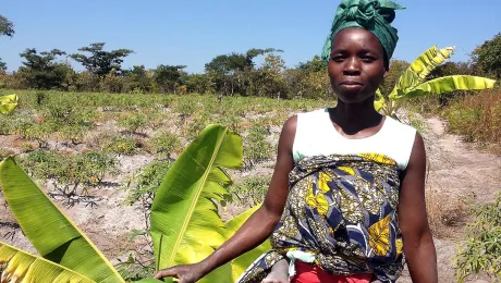 A woman in Angola works in the field. Photos: LWF/S. Oftadeh