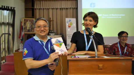 Bishop Ben Chun Wa Chang, Evangelical Lutheran Church of Hong Kong and Rev. Anne Burghardt, LWF study secretary for Ecumenical Relations, show the Chinese translation of the Reformation Anniversary booklets. Photo: LWF/A. Danielsson