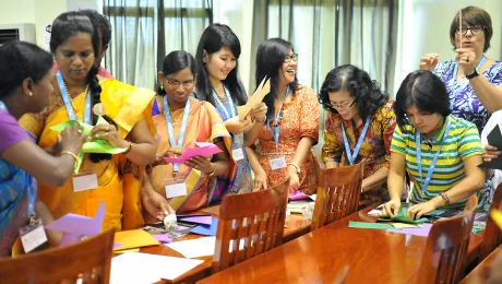 Women delegates from LWF member churches in Asia make paper windmills at the Women in Church and Society meeting, held before the regional Pre-Assembly. Photo: LWF/A. Danielsson