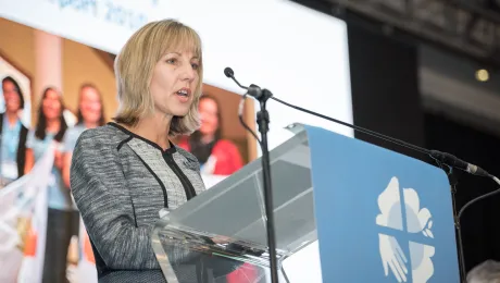 Christina Jackson-Skelton giving the report of the Finance Committee at the Lutheran World Federation's Twelfth Assembly. Photo: LWF/Albin Hillert