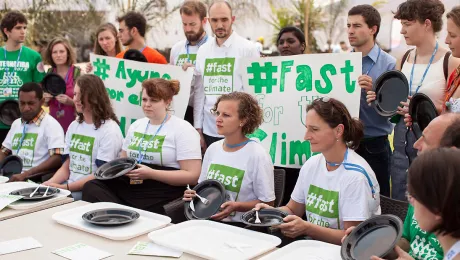 Fasting action at COP20. Photo: LWF/Sean Hawkey