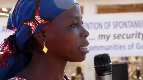 Aminatou Abubakar, president of the womenâs association in Minawao refugee camp, speaks at a public event about the dangers of spontaneous and unassisted return to Nigeria. Photo: LWF/ C. KÃ¤stner