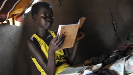 A young girl, refugee from South Sudan, studies in Adjumani, Northern Uganda. Lack of sanitation threatens the improving school enrolment for girls. Photo: LWF/ M. Renaux