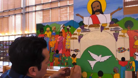 Artist Christian ChavarrÃ­a adds final touches to the Lund cross in the chapel of the Ecumenical Center, Geneva. Photo: LWF/ S. Gallay