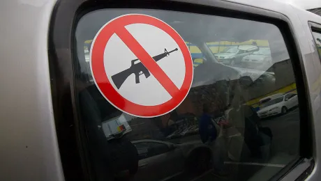 A sticker advises that weapons are not carried in the vehicle. Photo: ACT Alliance