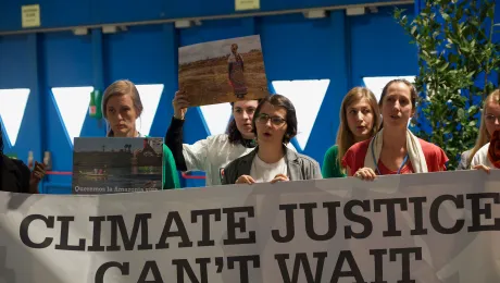 Young people urging for climate action during COP25 in Madrid, Spain. Photo: LWF/Albin Hillert