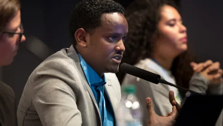 LWF Ethiopia program coordinator Biruk Kebede (center) speaks at the panel debate on Education, Youth and Climate Change at COP 22, in Marrakech, Morocco. Photo: LWF/Ryan Rodrick Beiler