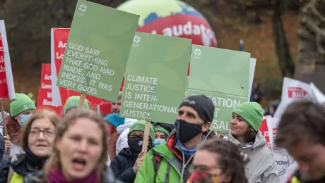 Representatives from the LWF joined a march through Glasgow city center, calling for climate justice and for world leaders to address the climate emergency at COP26. Photo: LWF/Albin Hillert