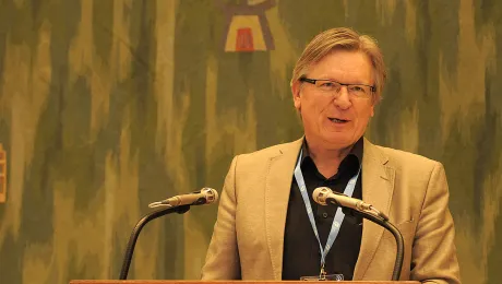 Dr Henk Stenvers, Mennonite World Conference Europe representative, greets the LWF Council at its June 2015 meeting in Geneva. Photo: LWF/Helen Putsma