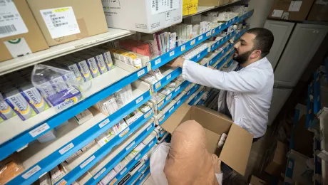 Dr Farmacist Nicolas Saliba restocks medicine at Augusta Victoria Hospital, Jerusalem. Photo: LWF/Albin Hillert