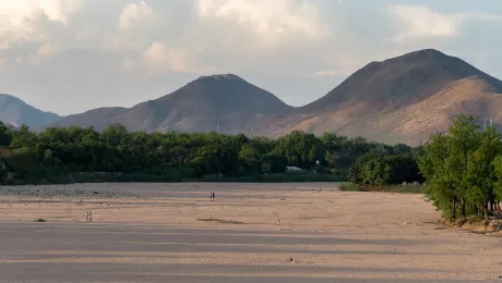 After an eight-month dry season, the riverbed of Tsanaga River lies dry at the outskirts of the city of Maroua, Cameroon. Photo: LWF/Albin Hillert