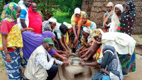 Women from Gawar in northern Cameroon building energy efficient clay stoves, as part of an LWF environmental program. Photo: Tcheou Tcheou ABEL