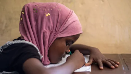 A girl from Somalia studies in an LWF primary school, Ali Addeh camp, Djibouti. LWF strongly advocated for girlâs education and against early marriage. Photo: LWF/ HelÃ©ne WikstrÃ¶m