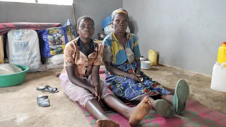  Caption: Bernadetta Myanura and her granddaughter Feza in the few square meters they have to themselves in the reception center. Photo: M. Renaux