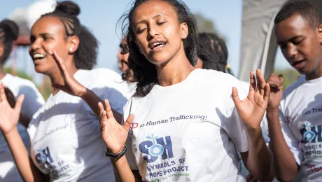 A youth group performs at the inauguration of Bishoftu Integrated Aquaculture Vocational and Entrepreneurship Training Centre in early 2019, taking a stand against human trafficking, and the poverty that often fuels it: âHuman beings â Not for Sale!â All photos: LWF/Albin Hillert