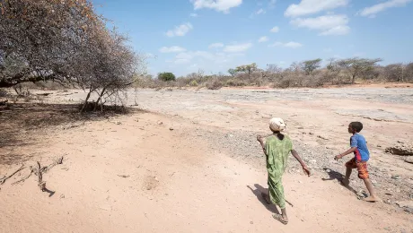 Children lead the way to the dry riverbed near Burka Dare site for internally displaced people, Oromia regional state, Ethiopia. All photos: LWF/Albin Hillert