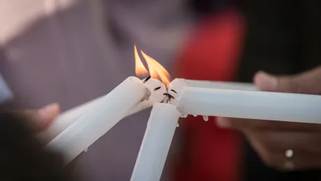 Lighting candles together. People of faith gather in a âPrayer for the Rainforestâ as part of the Cumbre Social por el Clima, on the fringes of COP25 in Madrid, Spain, where faith-based organizations urged decision-makers to take action for climate justice. Photo: LWF/Albin Hillert