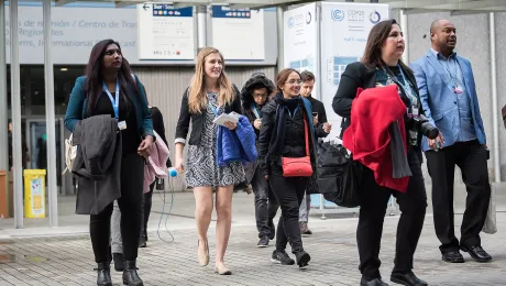  LWF Secretary for Youth Ms Pranita Biswasi (left) and other members of the LWF delegation walk toward the plenary hall on day one of COP 25 in Madrid.  LWF/Albin Hillert    