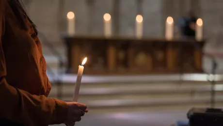 16 June 2019, Geneva, Switzerland: Gathered in Saint Peter's Cathedral in central Geneva, Emma van Dorp, a theology student from the Reformed congregation, lights five symbolic candles on the altar as the church leaders affirm the 'wish to make more visible our common witness in worship and service, on our journey together towards visible unity.' Photo: LWF/Albin Hillert