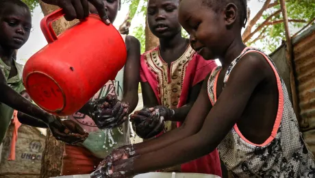 Children demonstrate hand washing at Kakuma refugee camp, Kenya. The LWF is the main implementer of education in the camp, and awareness-raising on hygiene is part of that work. The LWF has reinforced hygiene education to prevent the spread of COVID-19 in the camp. Photo: LWF/P. Omagwa