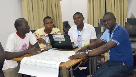 Council member Elijah Zina (second from right) discusses topics for the COP 20 meeting in Paris with a group of Youth delegates. Photo: Moses Aboka/ALCINET