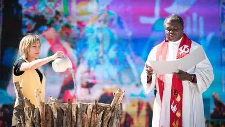 14 May 2017, Windhoek, Namibia: As Christina Jackson-Skelton, United States, pours water into the font as the words of Thanksgiving for baptism were spoken by Bishop Alex Malasusa, Tanzania. Photo: LWF/Albin Hillert