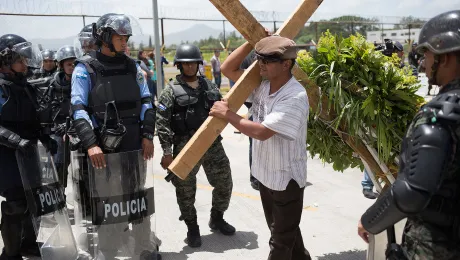 As part of the events to mark the tenth anniversary of the coup, Lutherans held a public prayer service at the spot where the first fatal victim of the coup was killed. Riot police and army surrounded the event as a memorial cross was carried to the center of the capital city afterwards. All photos: LWF/S.Hawkey