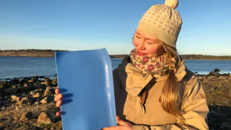 Solveig Egeland, an artist and cultural advisor to the Church of Norwayâs Diocese of Borg with a piece of plastic from the ocean. Photo: Mari Tefre