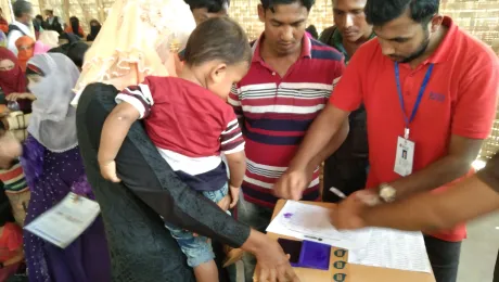 Rohingya refugees in Coxâs Bazaar IDP camp receive a distribution of WASH kits by LWF's local partner. Photo: LWF/ B. Khanal